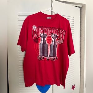 Red Wings Champions printed on a Lee tee front and back graphic